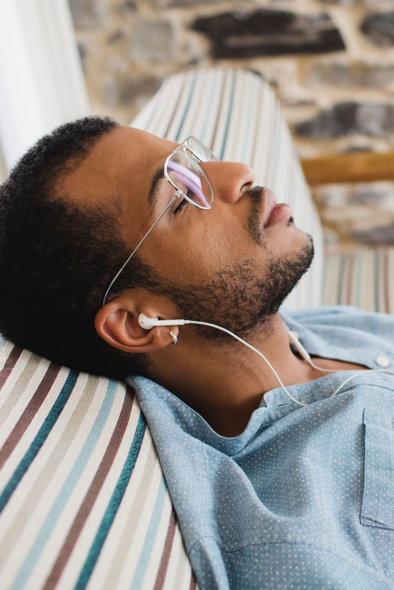 Man Relaxing At Home With The Music