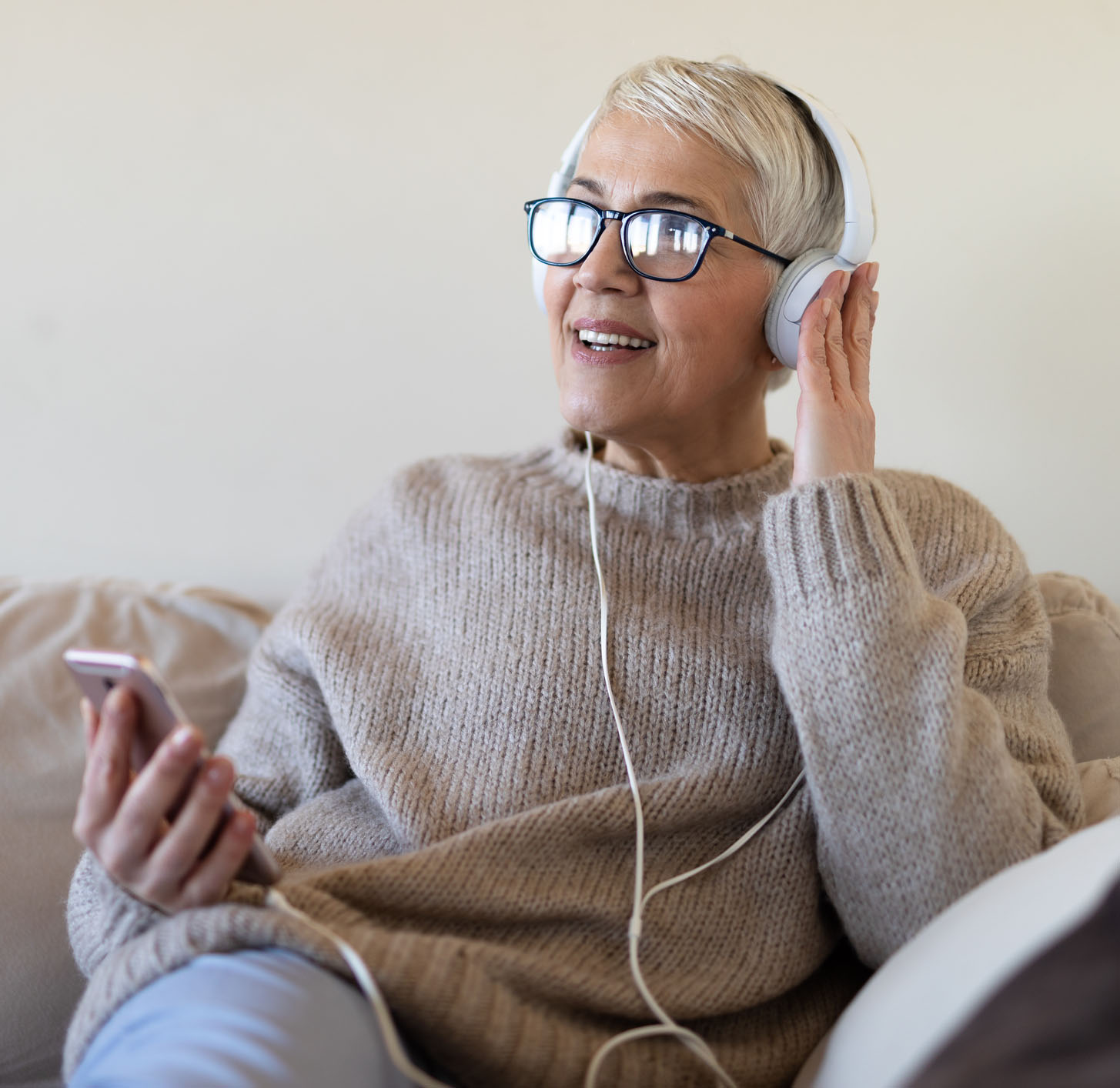 Senior woman listening to music